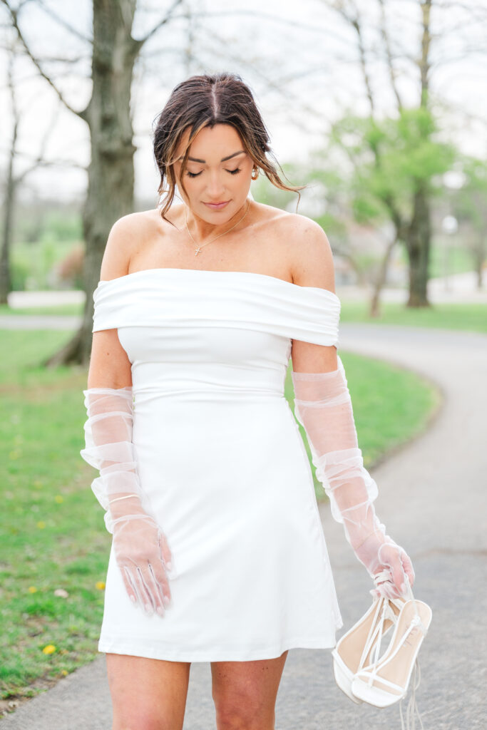 bride posing with shoes during lexington wedding